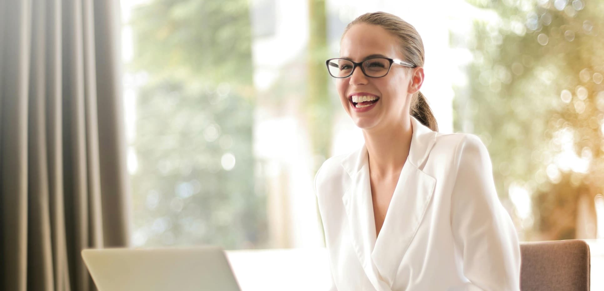 Professional using AI tools in a modern workspace, representing AIBX’s AI transformation accelerator